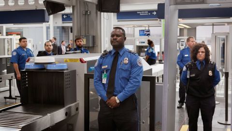 TSA officers staff a checkpoint at O'Hare International Airport in Chicago.