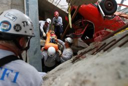 Rescue workers lift a victim out of the Disaster City parking garage.