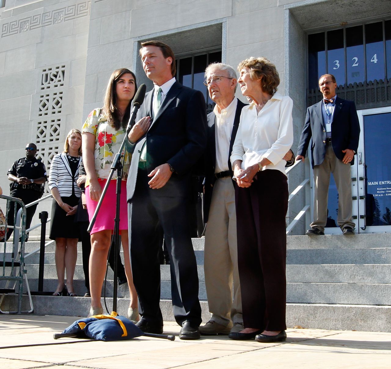 Edwards addresses the media after his acquittal and mistrial, with his daughter Cate and his parents Wallace and Bobbie Edwards at his side, outside the Greensboro courthouse on Thursday, May 31, 2012. After nine days of deliberation, a jury acquitted Edwards on one count but deadlocked on five other counts in his corruption trial. It's unclear what the Justice Department will do next, but Edwards says his years of service aren't over.