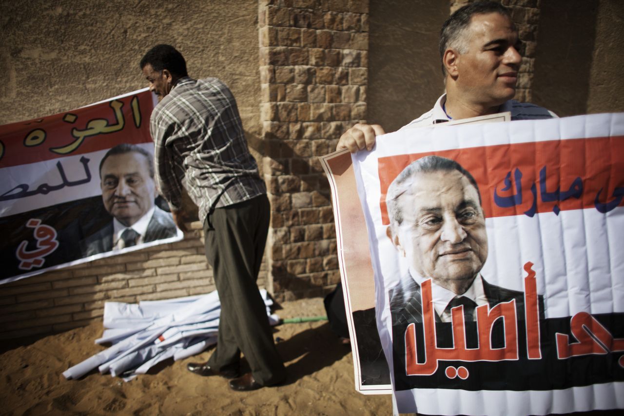 Mubarak supporters rally outside the courthouse after news of the verdict was handed down.