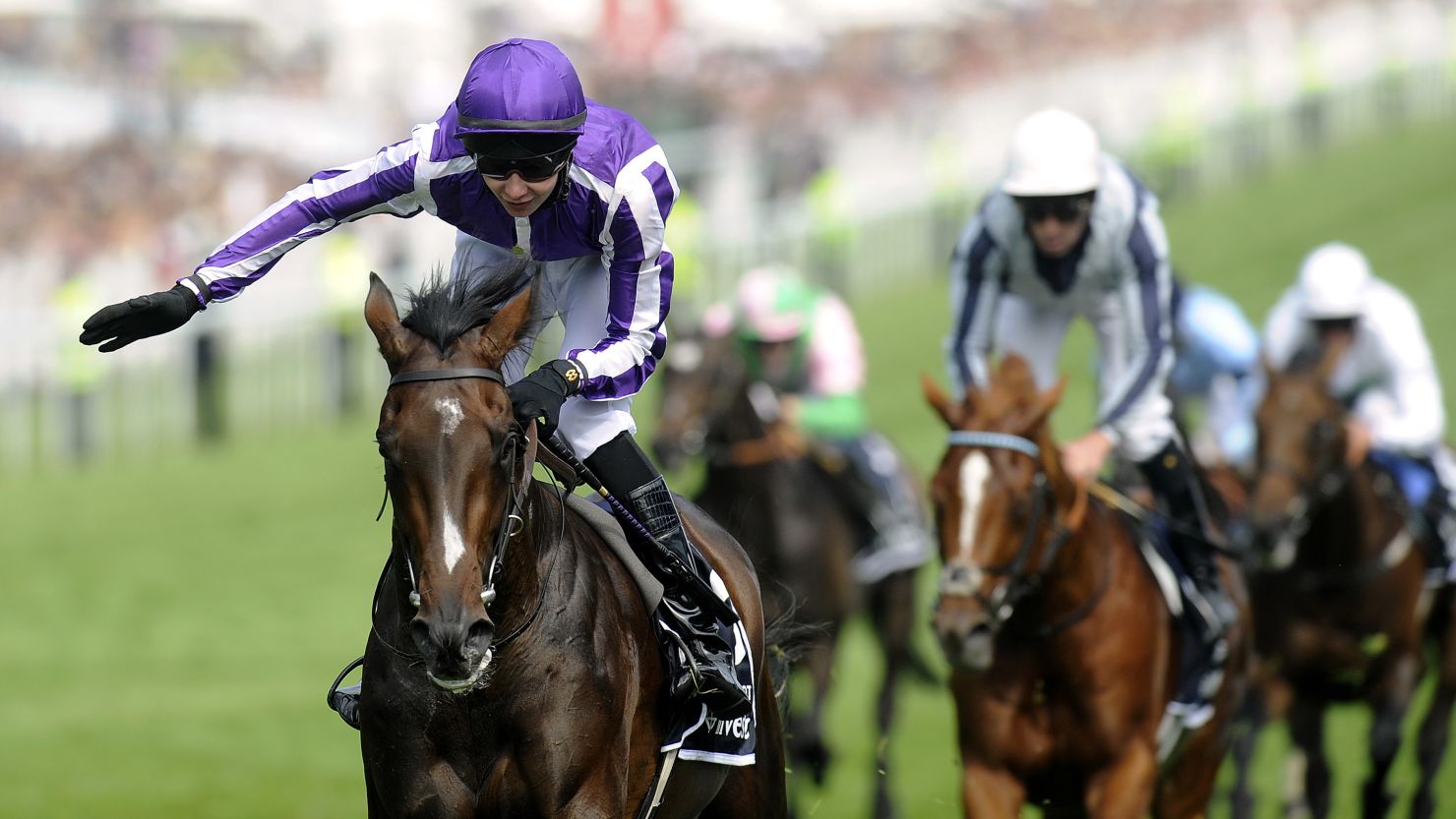 Teenage jockey Joseph O'Brien rode his father's horse Camelot to victory at Epsom Racecourse on Saturday.