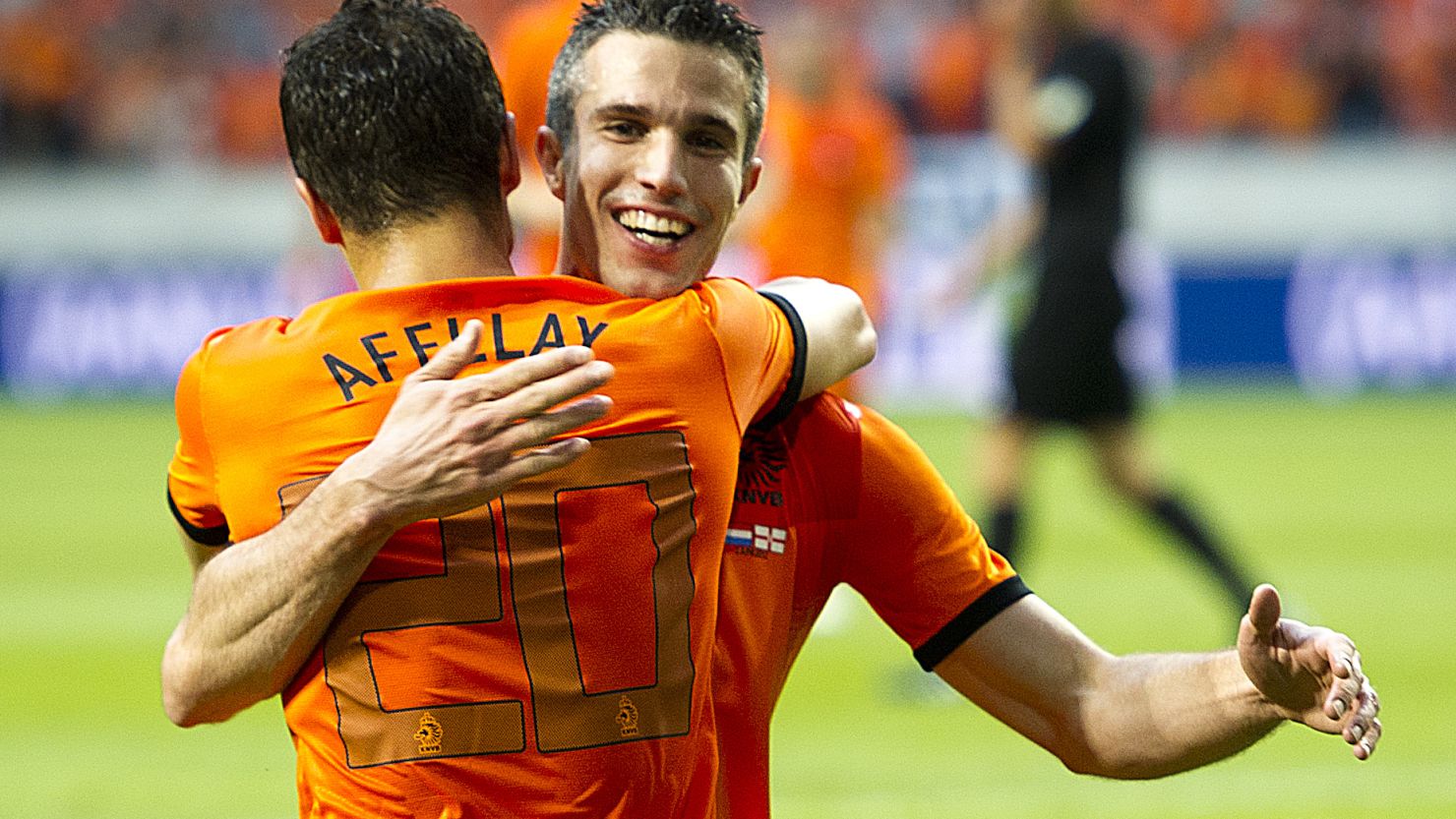Robin van Persie celebrates with Ibrahim Afellay, who also scored twice in the Netherlands' 6-0 win against Northern Ireland.