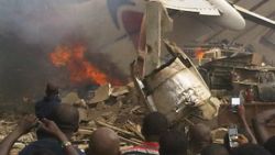 A photograph taken at the site of the Dana Airlines passenger plance that crashed into a building in Lagos, Nigeria on Sunday.