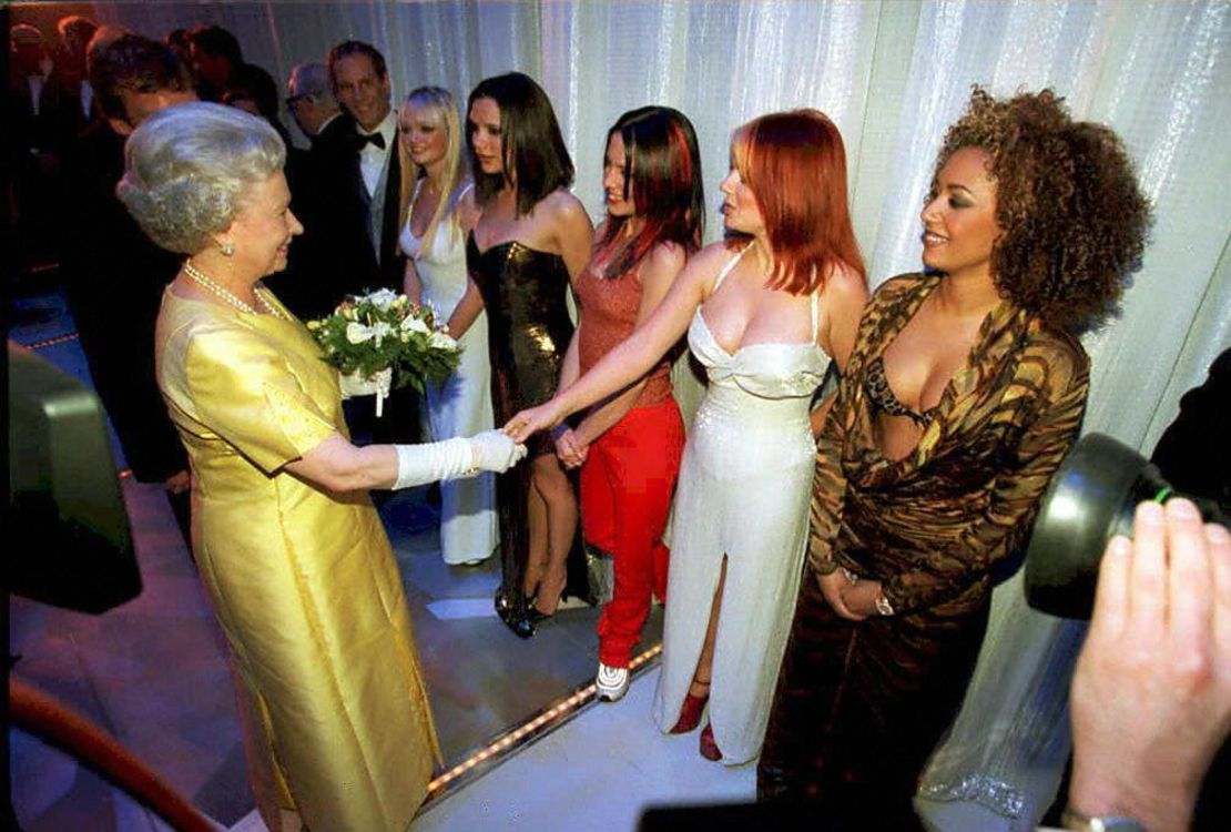 In 1997, the Queen met girlband the Spice Girls after a variety performance in London. Here, she shakes hands with Geri 'Ginger Spice' Halliwell as the rest of the group look on. 