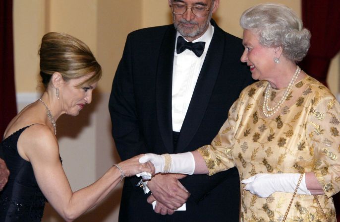 The queen of pop meets the queen of England -- Madonna curtsies as she meets the queen at the world premiere for 2002 Bond film, 'Die Another Day.'