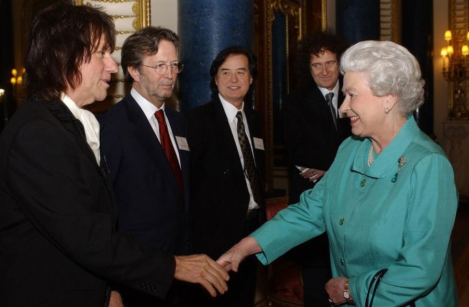 Queen Elizabeth II meets legendary guitarists Jeff Beck, Eric Clapton, Jimmy Page and Brian May during a reception at Buckingham Palace in London, 1 March 2005. The all-star gathering is a royal tribute to Britain's music industry and follows an earlier children's concert at the Palace