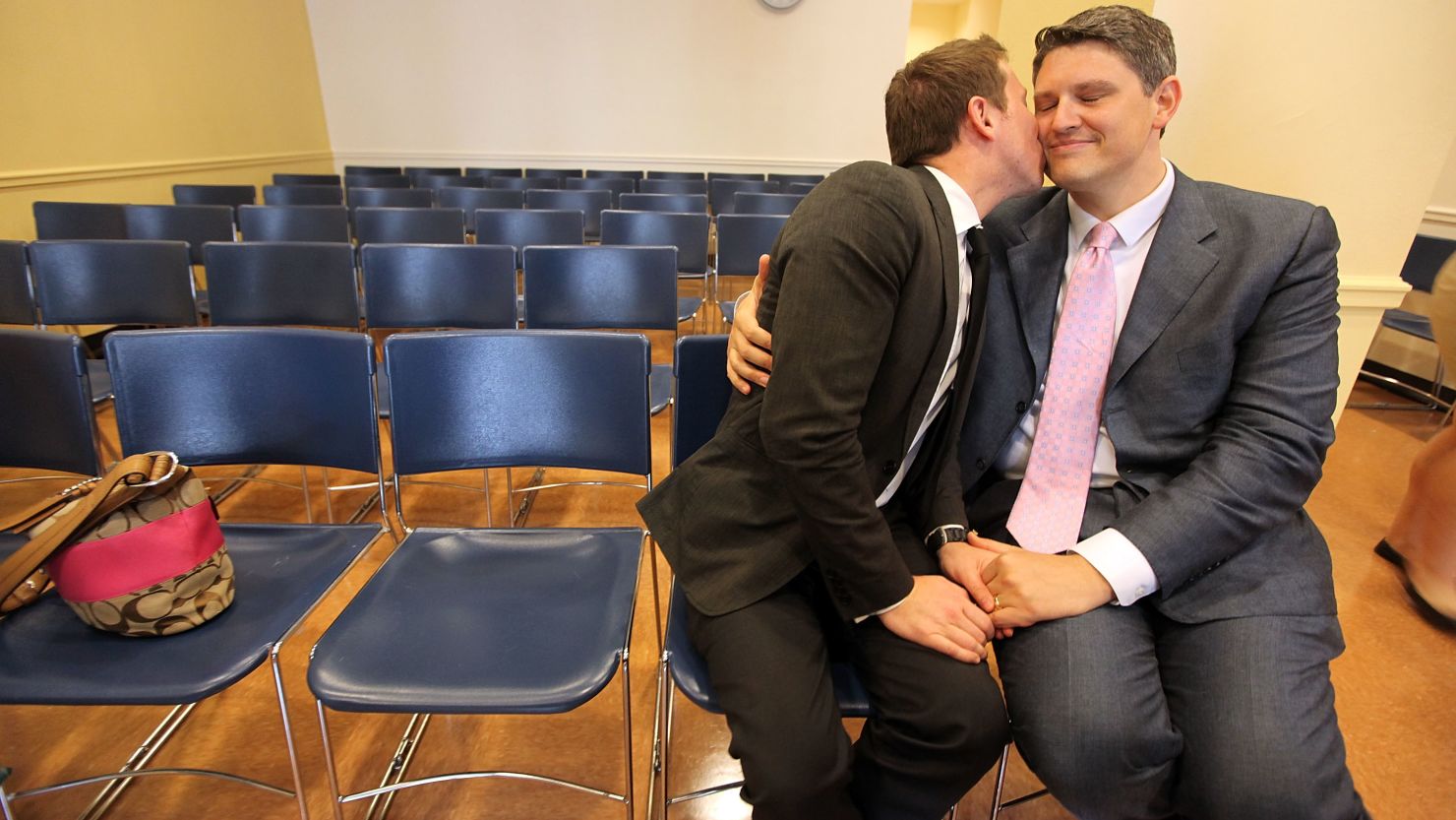 A gay couple embrace on their wedding day at the Brooklyn City Clerk's office on July 24, 2011, in New York City. 