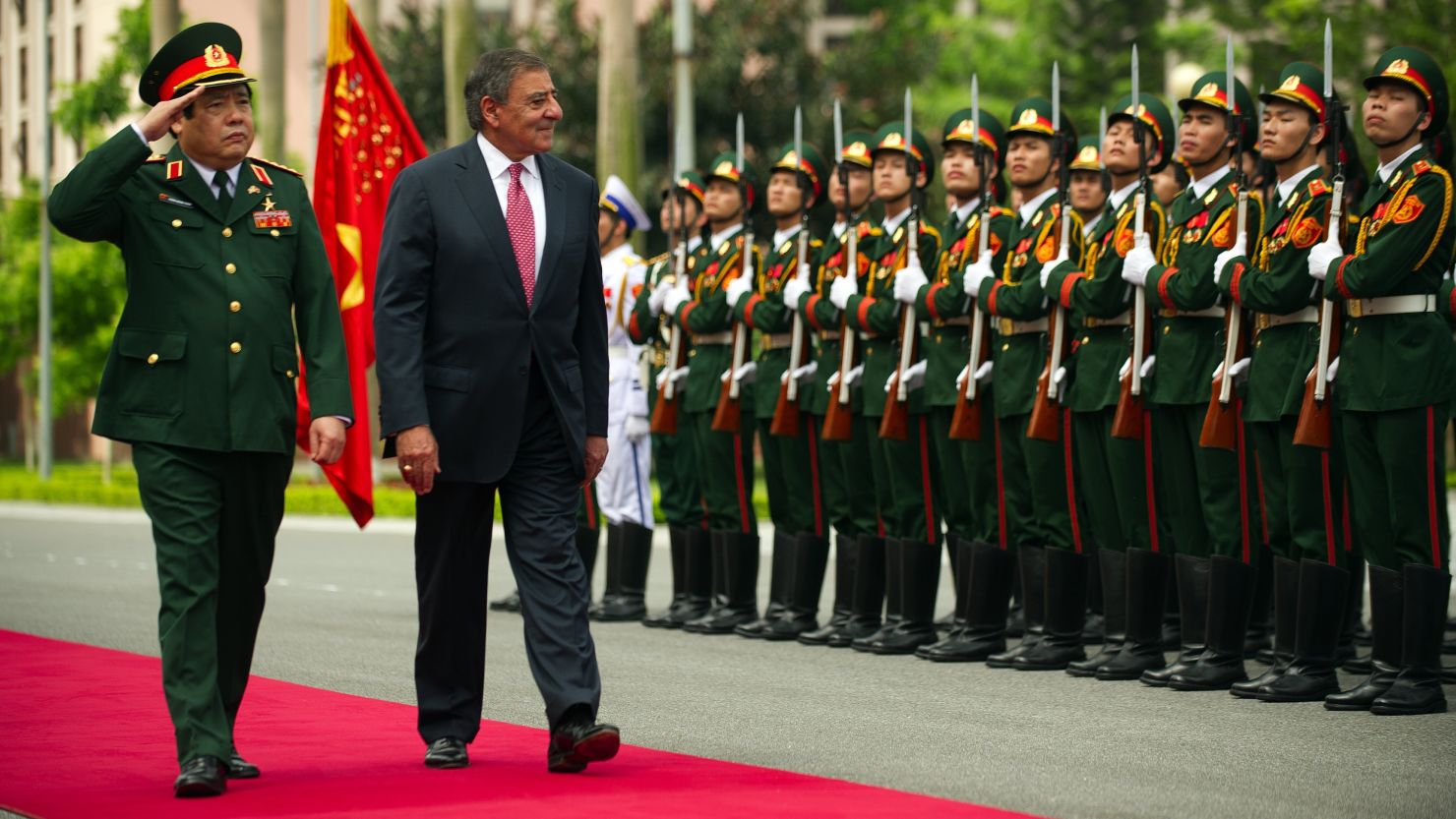 U.S. Defense Secretary Leon Panetta joins Vietnamese Defense Minister Phung Quang Thanh at a ceremony Monday in Hanoi.