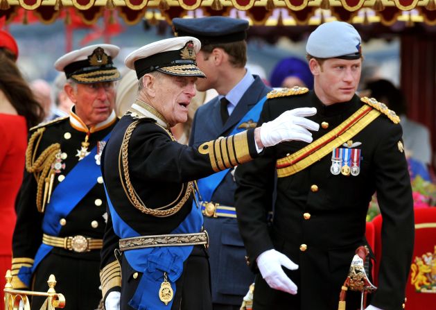 Prince Charles, left, Prince Philip, Prince William and Prince Harry talk during the Thames Diamond Jubilee Pageant on Sunday.