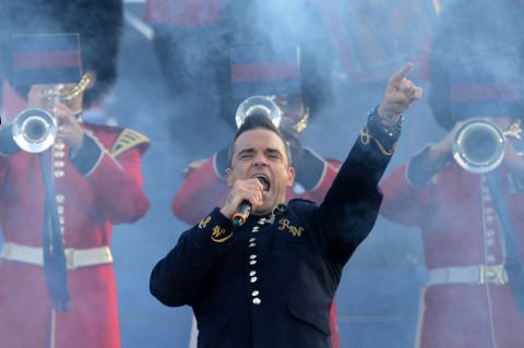 British singer-songwriter Robbie Williams performs on stage at the opening of the concert at Buckingham Palace.