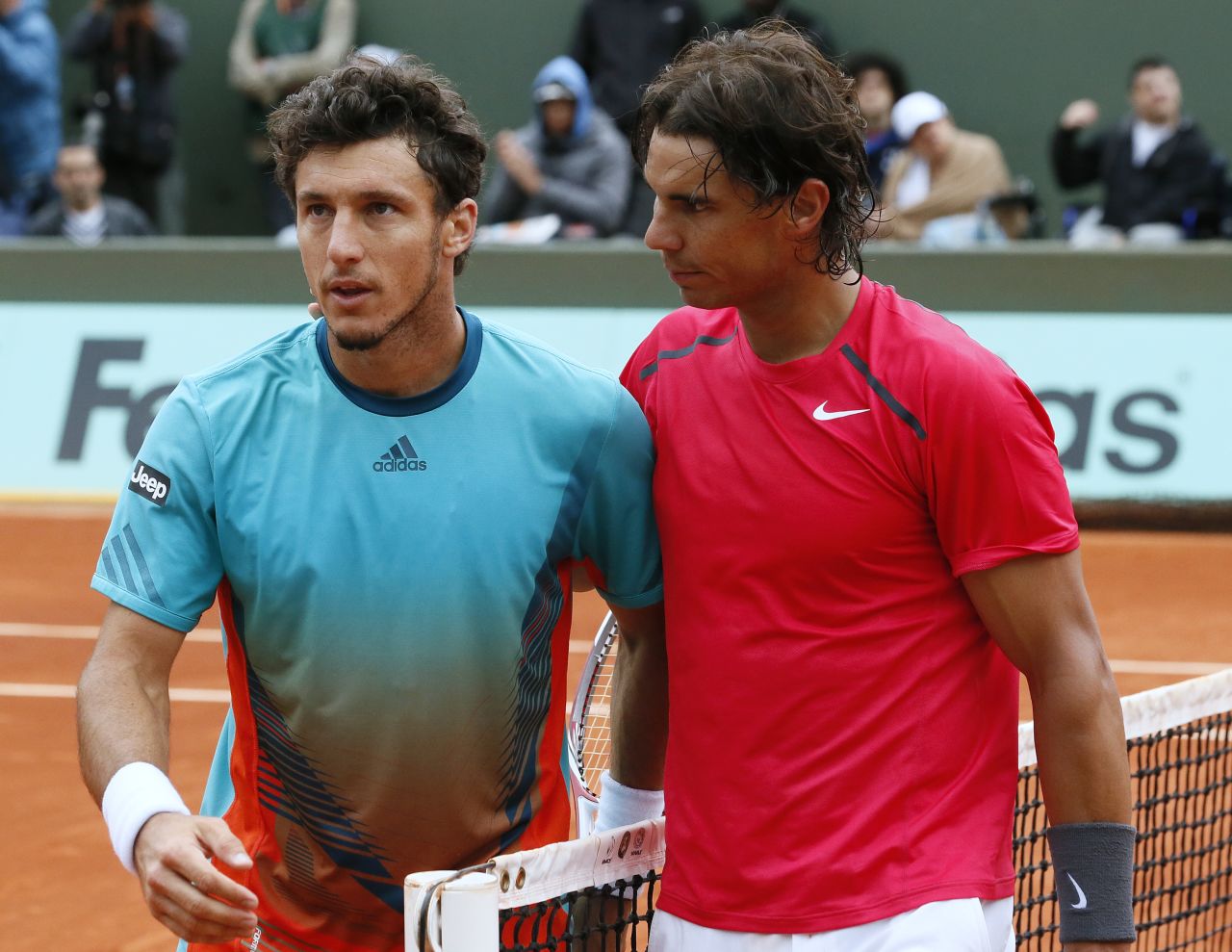 Rafael Nadal, right, was apologetic after winning 17 games in a row in his straight-sets destruction of good friend Juan Monaco in the fourth round of the French Open.