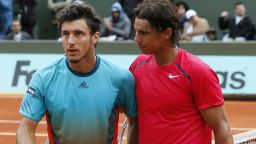 Rafael Nadal, right, was apologetic after winning 17 games in a row in his straight-sets destruction of good friend Juan Monaco in the fourth round of the French Open.