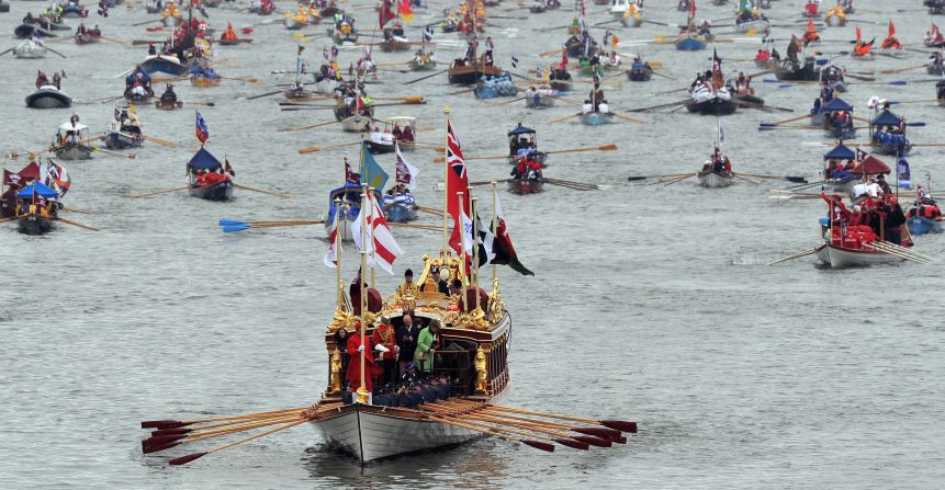 The queen's royal rowbarge, Gloriana, leads the way for the manpowered boats during the Diamond Jubilee Thames Pageant. The boat is powered by 18 oarsmen and was unique among the participating vessels because it was the only boat specially commissioned for the event.