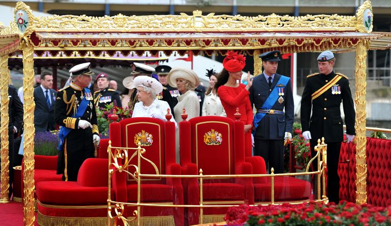 Members of the Royal family (from left to right) Prince Charles, Prince of Wales, Queen Elizabeth II, Camilla, Duchess of Cornwall, Catherine, Duchess of Cambridge, Prince William and Prince Harry stand onboard the Spirit of Chartwell.
