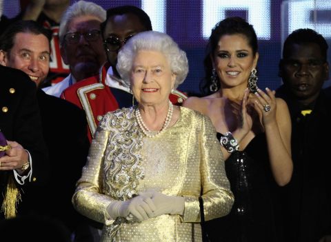 Queen Elizabeth II appears on stage at the climax of the diamond jubilee concert at Buckingham Palace in London, England.
