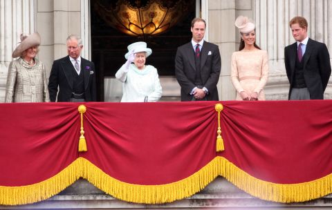 Camilla, Duchess of Cornwall, Prince Charles, Prince of Wales, Queen Elizabeth II, Prince William, Duke of Cambridge, Catherine, Duchess of Cambridge and Price Harry wave to the crowds from Buckingham Palace.
