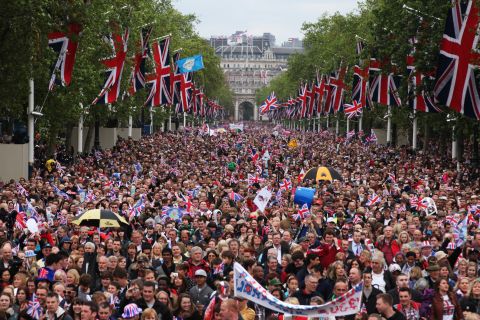 The crowd is escorted down The Mall during the Diamond Jubilee carriage procession after the service of thanksgiving at St.Paul's Cathedral.