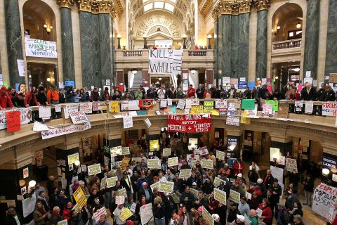 Union members and protesters fill the capitol rotunda in Madison.