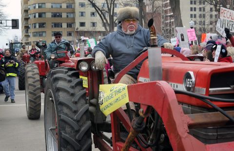 Farmers drive past the Wisconsin State Capitol during a rally March 12, 2011, in Madison.