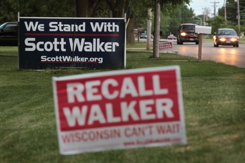 Opposing signs along a rode in Beloit, Wisconsin, can be seen on June 4, the day before voting in the recall election.