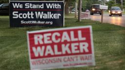 BELOIT, WI - JUNE 04:  Neighbors display signs with opposite views on the Wisconsin recall election June 4, 2012 in Beloit, Wisconsin. Milwaukee Mayor Tom Barrett, a  Democrat, is trying to unseat Republican Wisconsin Governor Scott Walker in the recall election scheduled for tomorrow. Opponents of Walker forced a recall election after the governor pushed to change the collective bargaining process for public employees in the state.  (Photo by Scott Olson/Getty Images)