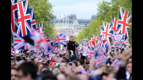 A boy waits for the start of the Queen's Diamond Jubilee Concert at Buckingham Palace.