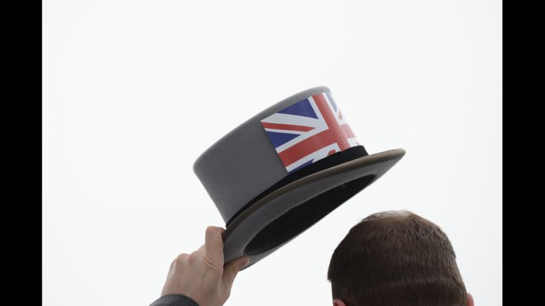 A racegoer attends Derby Day, the second day of the Epsom Derby horse racing festival.