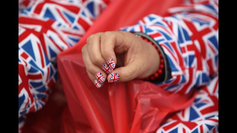 A woman with Union Jack painted nails waits for The Diamond Jubilee Concert to start.