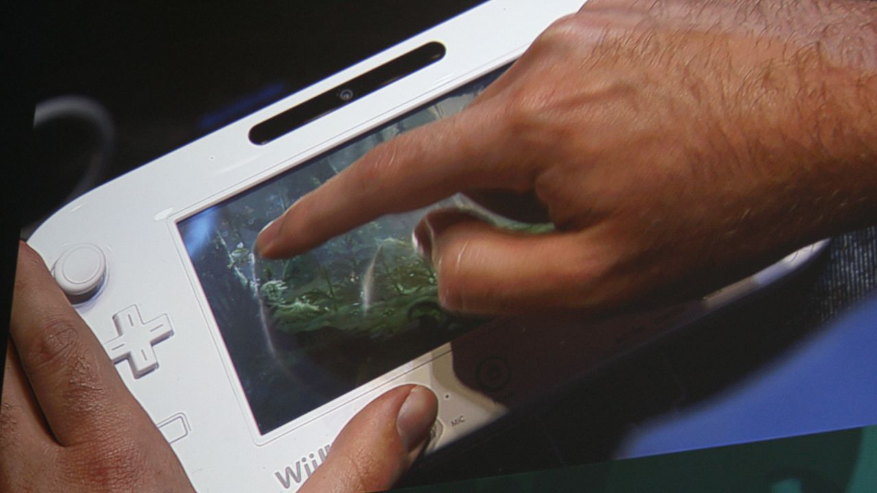 The Wii U handheld game pad is used to display a game during a presentation by developers Ubisoft.