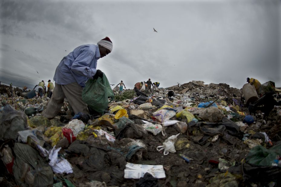 A <em>catadore</em> sifts through the trash at the Jardin Gramacho landfill site in Rio de Janeiro. The facility was closed in 2012 but featured as the backdrop for the 2010 Oscar nominated movie, "Wasteland."