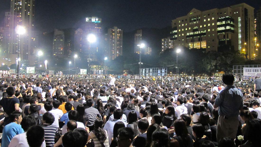 Organizers reported a record 180,000 attendees, spilling out of six football pitches at Victoria Park on Hong Kong Island.