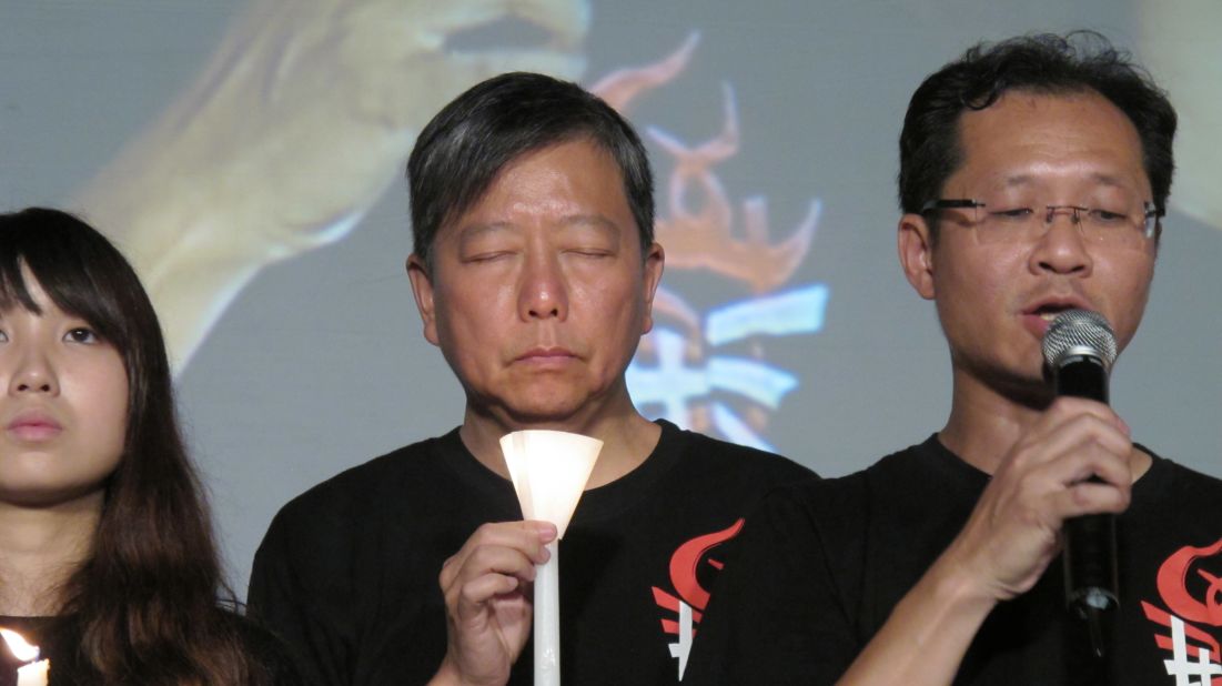 A moment of remembrance is reflected in the face of Andrew Lee Cheuk-yan, chairman of the organizing Hong Kong Alliance in Support of Patriotic Democratic Movements of China.  