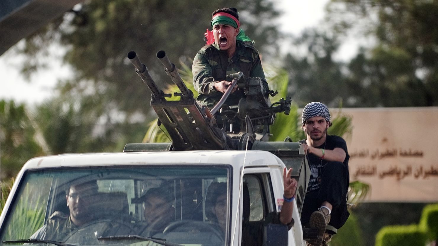 Libyan government forces arrive at Tripoli international airport on June 4, 2012. 