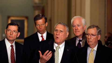 Sen. Jon Kyl of Arizona answers reporters' questions alongside other Republican senators after the equal-pay vote.