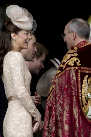 Catherine, Dutchess of Cambridge, smiles as she arrives at St Paul's Cathedral. Thousands of well-wishers crowded against security barriers to welcome all of the arrivals at St Paul's. 