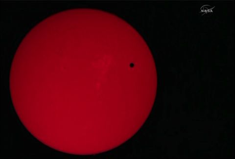 Venus transiting in front of the Sun.