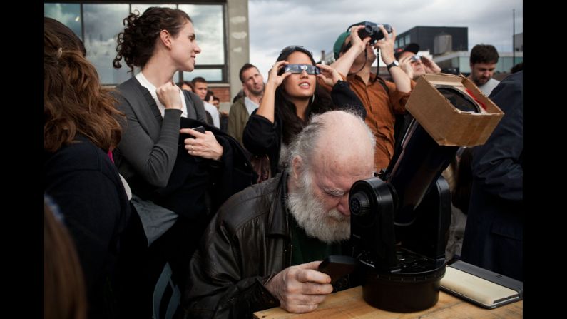 Ray Dobbins of New York uses a telescope to observe the transit of Venus at the High Line park in Manhattan.