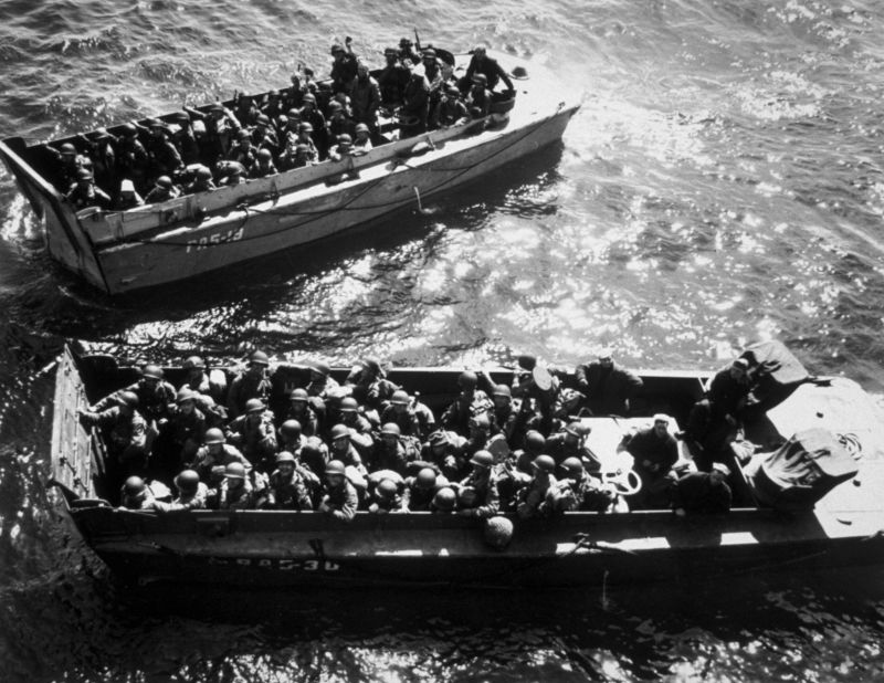 U.S. troops wait to disembark a landing craft on D-Day.