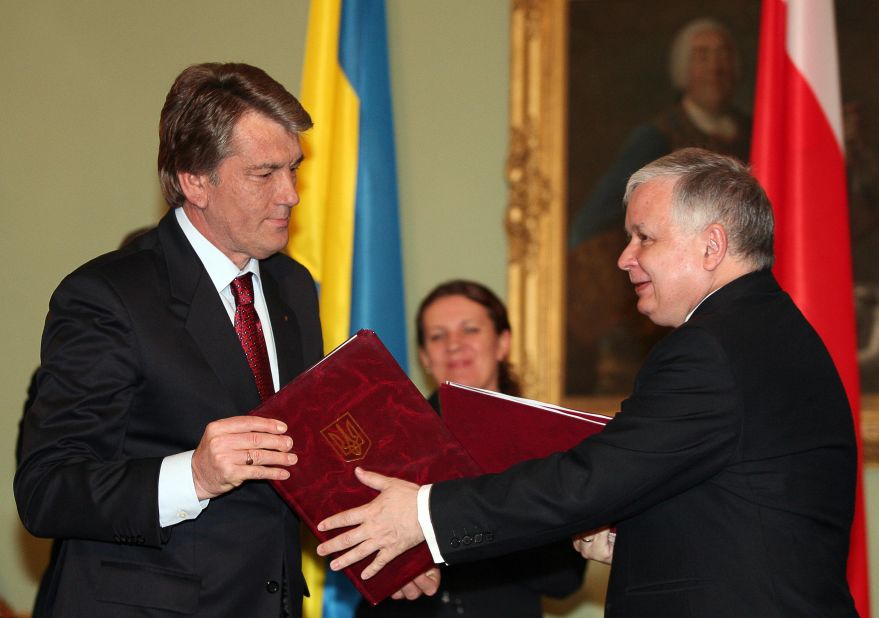 Instead the joint bid from Ukraine and Poland, which had been third favorite out of three candidates, was awarded the event. Here former Ukrainian President Victor Yushchenko (R) exchanges a signed trade agreement with his Polish counterpart Lech Kaczynski in Warsaw. 