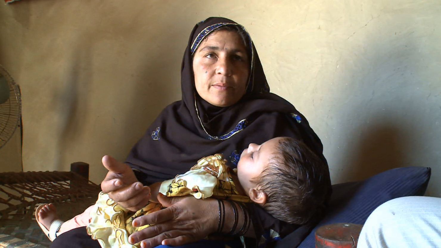 Polio-stricken 3-month-old Ikra and her mother in Nowshera, Pakistan, in July.