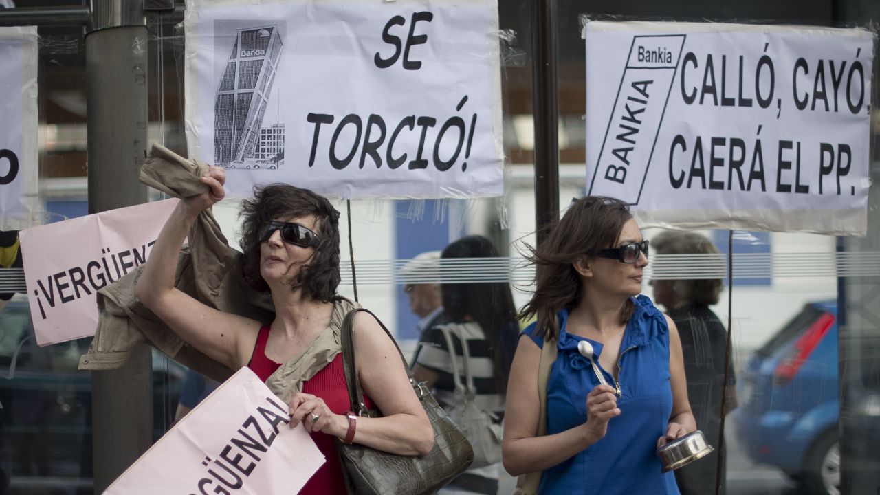 People demonstrate in front of the headquarters of Spanish bank Bankia in Madrid. 