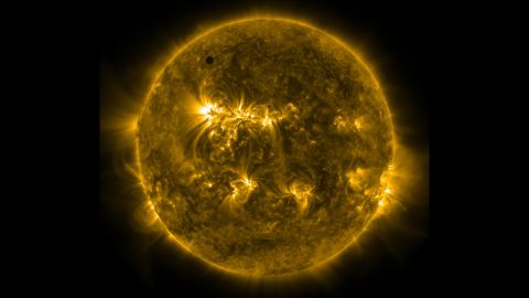 An ultraviolet image taken from NASA's Solar Dynamics Observatory spacecraft shows Venus at the top left of the sun.