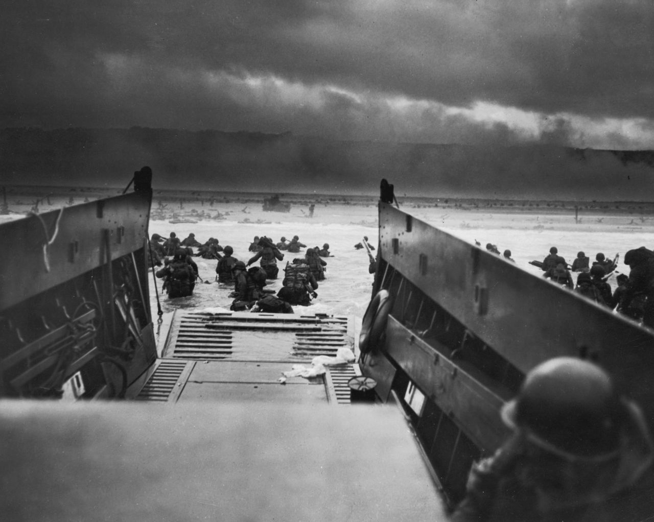 American troops storm the beaches of Normandy, France, on June 6, 1944. D-Day was the largest amphibious invasion in history. More than 160,000 Allied troops -- about half of them Americans -- invaded Western Europe, overwhelming German forces in an operation that proved to be a turning point in World War II.