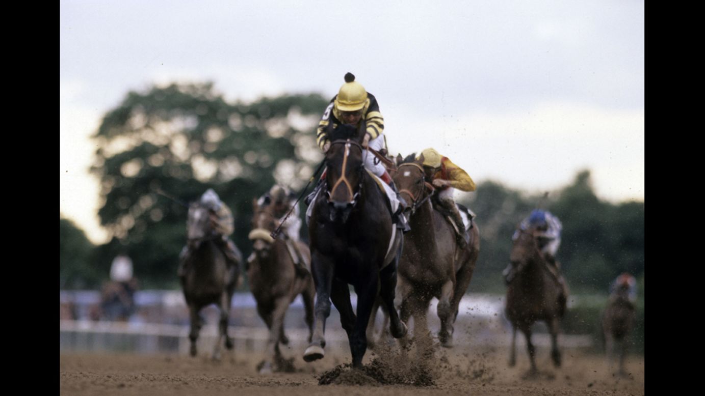 Jockey Jean Cruguet guides Seattle Slew to the Triple Crown in 1977.