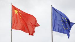 The Chinese and EU flags flutter in the wind as Chancellor Angela Merkel meets China's Vice-President Xi Jinping prior to talks at the chancellery in Berlin October 12, 2009.