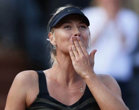 Russian tennis star Maria Sharapova blows a kiss to the crowd after beating Petra Kvitova at Roland Garros on Thursday to reach her first French Open final.