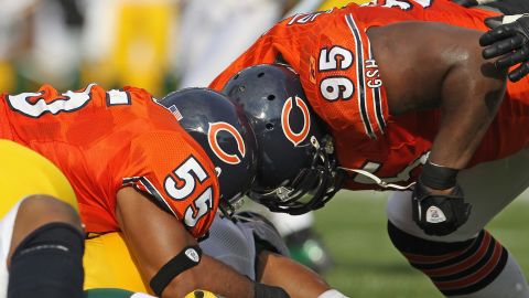 Two Chicago Bears players collide on a tackle against the Green Bay Packers in 2011. 
