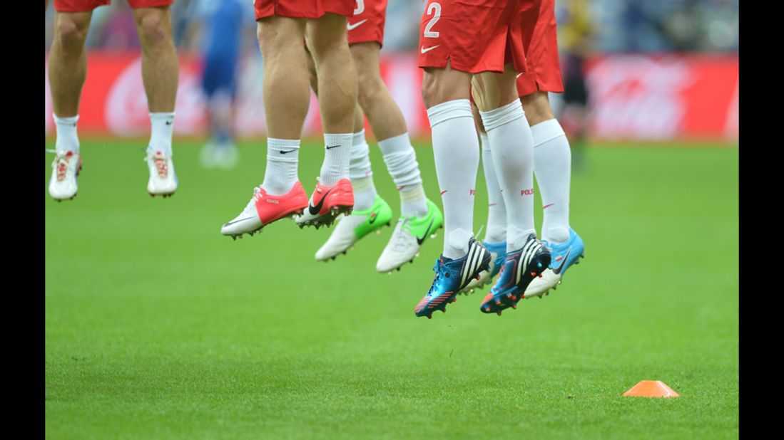 Players warm up before the match between Poland and Greece.