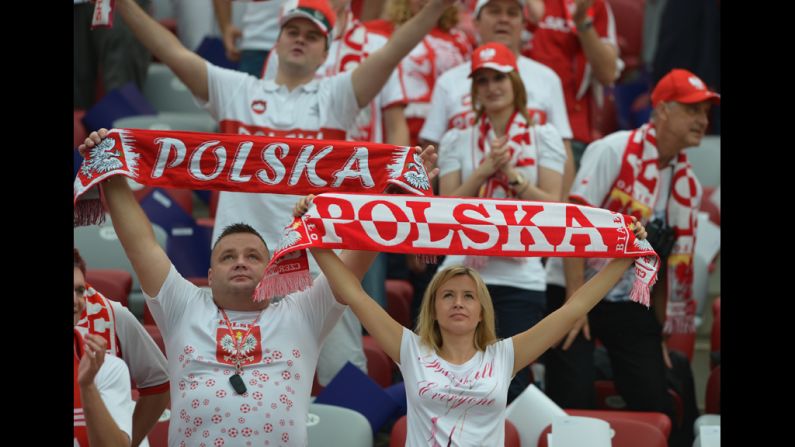 Polish fans hold up banners before the Euro 2012 match between Poland and Greece.