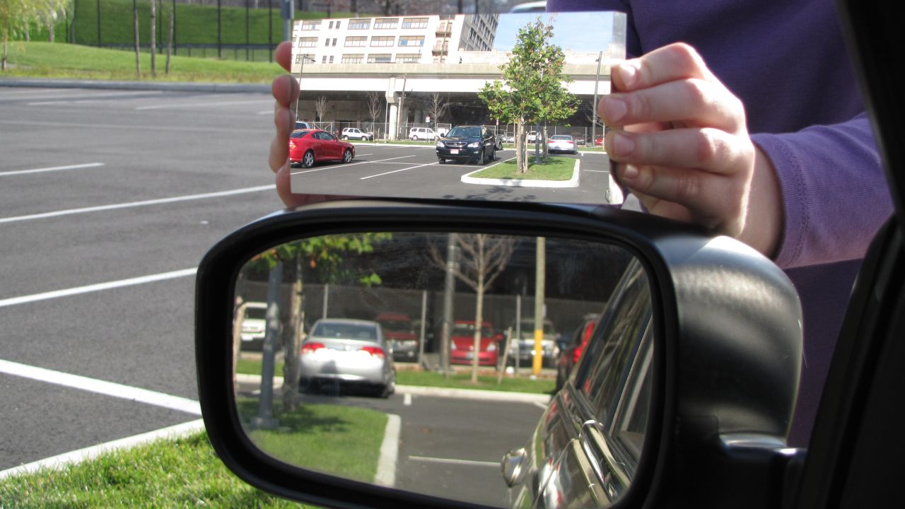 The newly patented mirror, above, shows a much wider view compared to a standard side-view mirror.